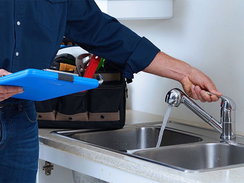 Person checking the tap water flow