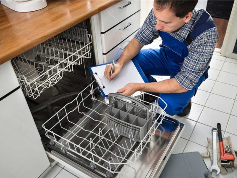 Plumber checking the dishwasher