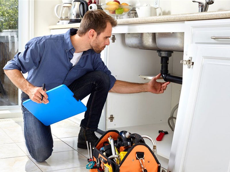 Plumber checking the sink