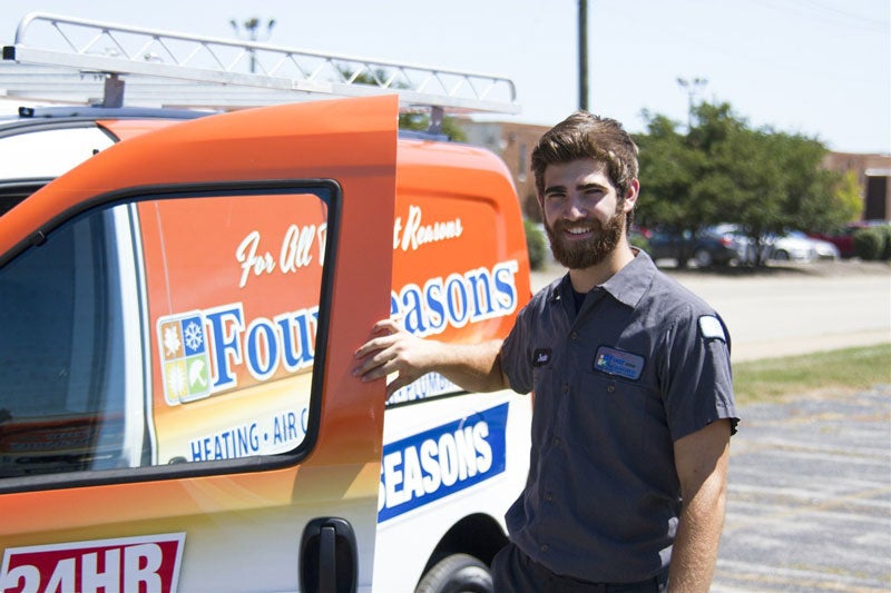 technician closing door to van