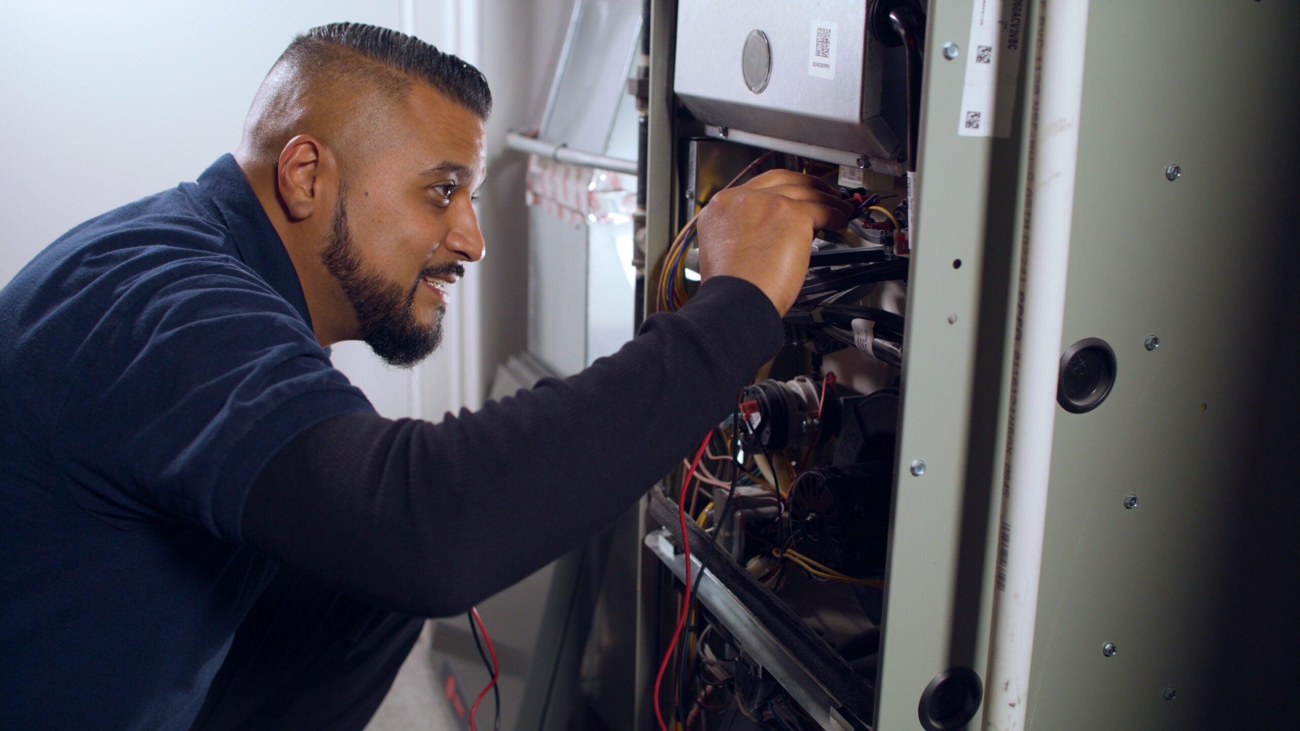 Technician performing furnace tune-up.