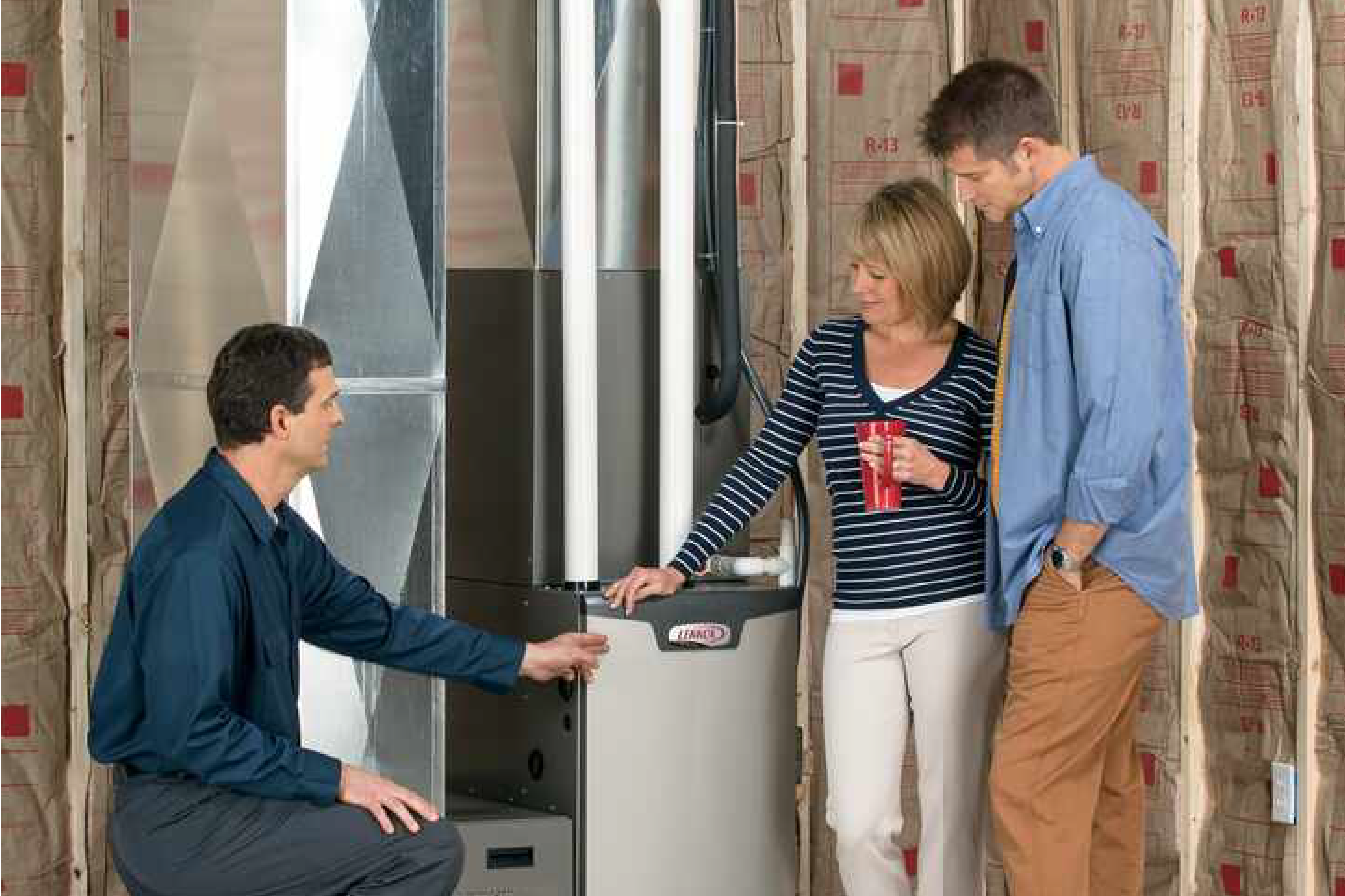 Salesperson discussing furnace replacement with a homeowner.