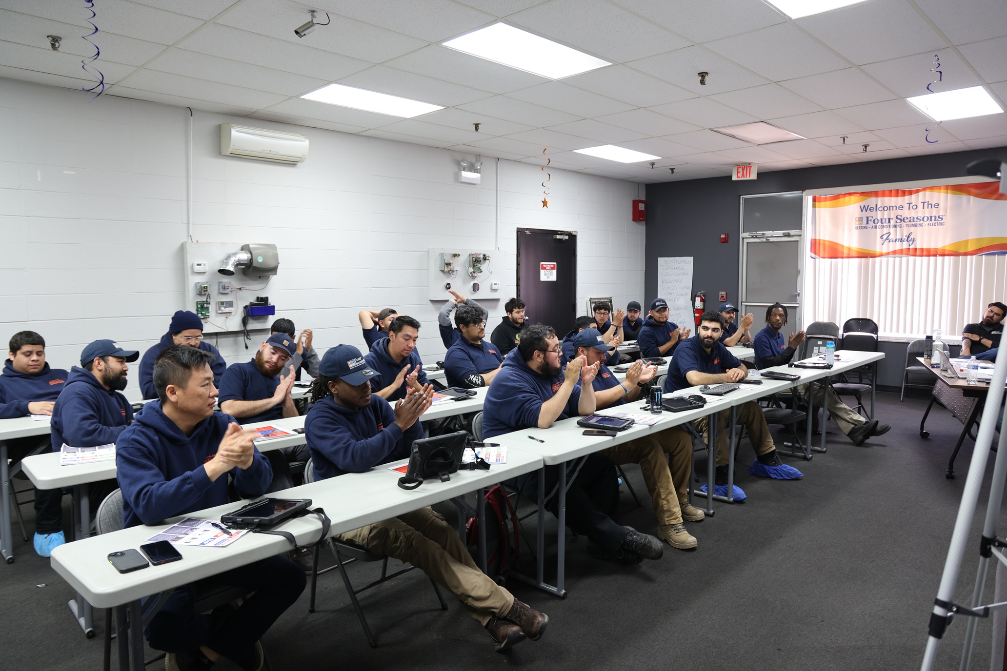 HVAC Techs Applauding in a Training Session