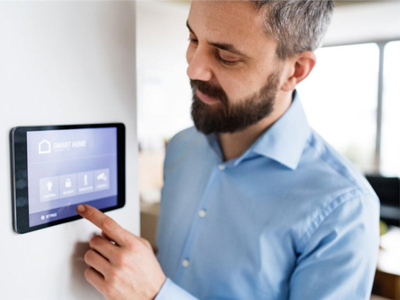 client setting up thermostat digital panel